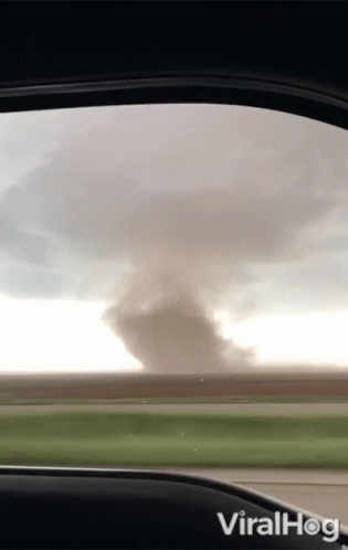 A View Of A Tornado From Inside A Car With The Words Viralhog On The Bottom GIF