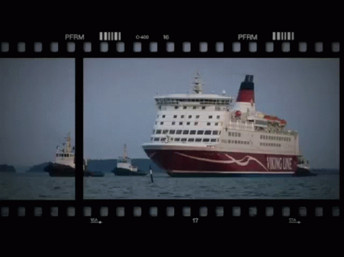 A Viking Line Cruise Ship Is Being Towed By A Tugboat GIF