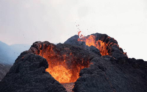 A Volcano Is Erupting With A Lot Of Flames GIF