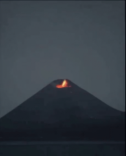 A Volcano Is Erupting With A Lot Of Smoke Coming Out Of It GIF