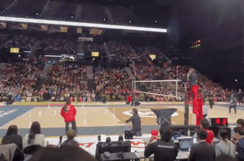 A Volleyball Game Is Being Played In A Stadium GIF