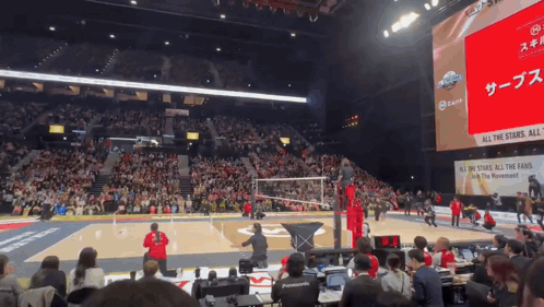 A Volleyball Game Is Being Played In A Stadium With A Sign That Says All The Stands All The Fans GIF