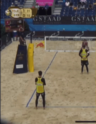 A Volleyball Game Is Being Played With A Scoreboard That Says Gstaad In The Background GIF