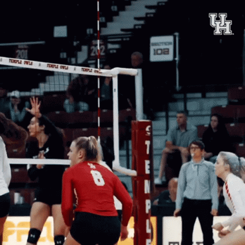 A Volleyball Player Wearing A Red Jersey With The Number 8 On The Back GIF