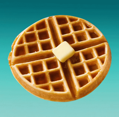 a waffle with syrup and butter on it on a blue background