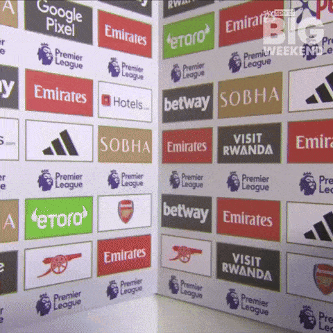 A Wall With A Lot Of Advertisements Including Emirates Hotels Betway And Etoro GIF