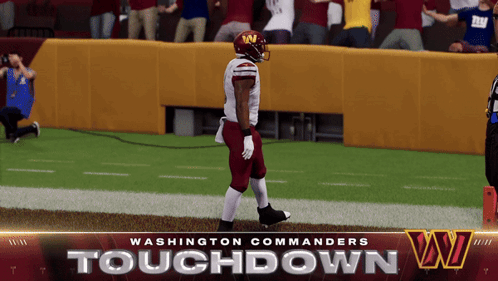 A Washington Commanders Football Player Is Walking On The Field GIF