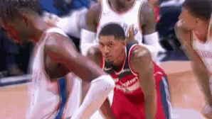 A Washington Wizards Player Is Kneeling On The Court GIF