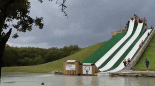 A Water Slide Has A Sign That Says Rapid Flash GIF