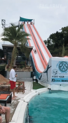 A Water Slide With A Sign That Says " Fight Your Fear " GIF