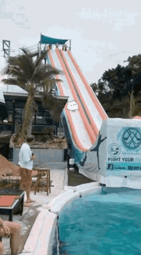 A Water Slide With A Sign That Says Fight Your Waves GIF