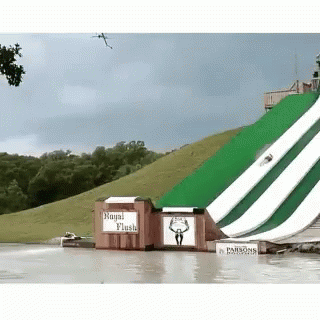 A Water Slide With A Sign That Says " Royal Flush " GIF