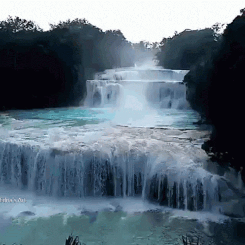 A Waterfall Is Surrounded By Trees And A White Background With The Word Art On The Bottom Right GIF