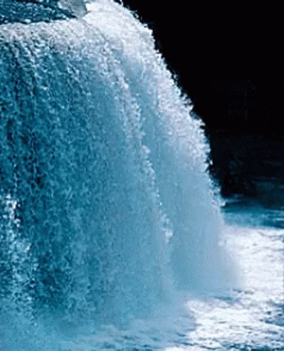 A Waterfall With A Black Background And A Lot Of Water Coming Down It GIF