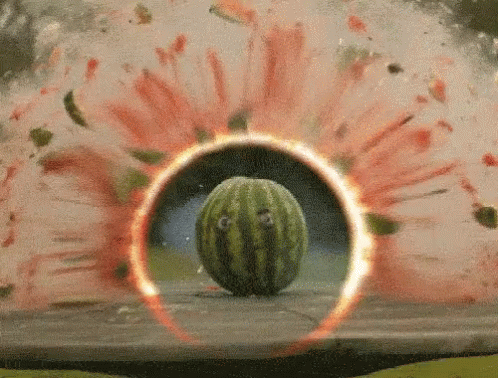 A Watermelon Is Surrounded By A Circle Of Fire GIF