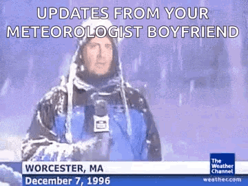 A Weatherman Is Standing In The Snow With A Microphone In His Hand And Says Updates From Your Meteorologist Boyfriend . GIF