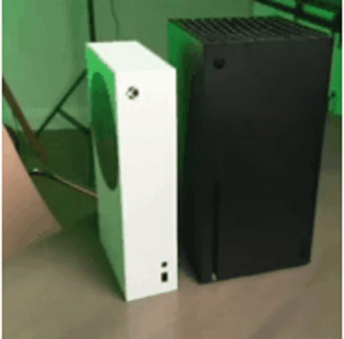 A White And A Black Box Are Sitting Next To Each Other On A Wooden Floor . GIF
