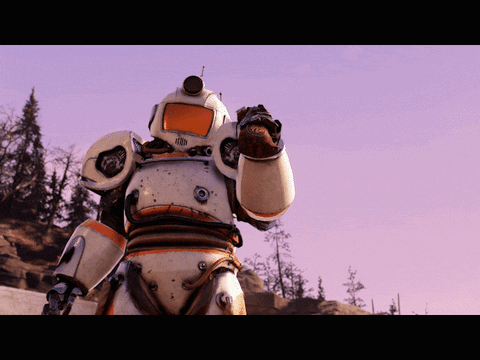 A White And Orange Robot With A Helmet On Stands In A Field With Trees In The Background GIF