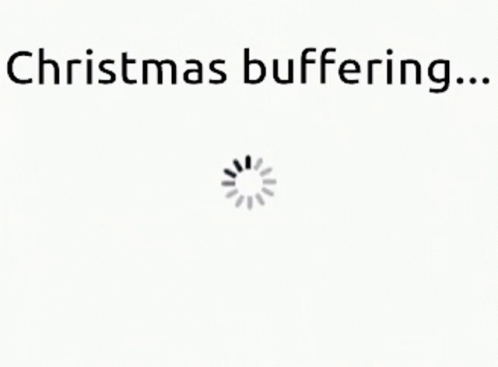 a white background with the words `` christmas buffering ... '' and a loading spinner .