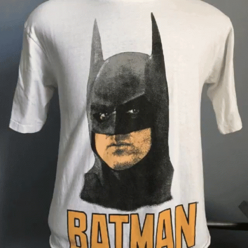 A White Batman T-Shirt With A Picture Of Batman On It GIF