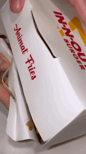 A White Box With Animal Fries Written On The Side GIF