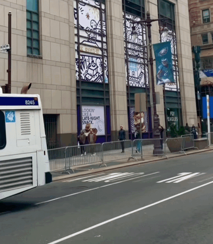 A White Bus With The Number 8245 On The Back GIF