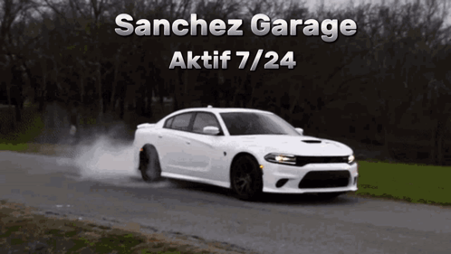 A White Car Driving Down A Road With The Words Sanchez Garage Aktif 7/24 GIF