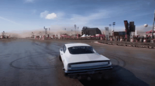 A White Car Is Driving Down A Dirt Road With A Sign That Says ' R ' On It GIF