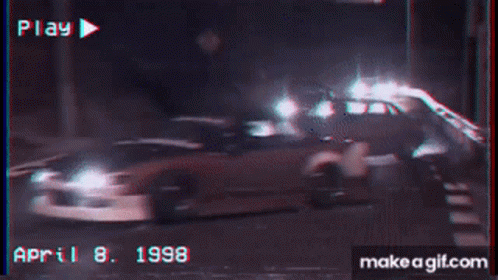A White Car Is Driving Down A Road And The Date Is April 8 1998 GIF