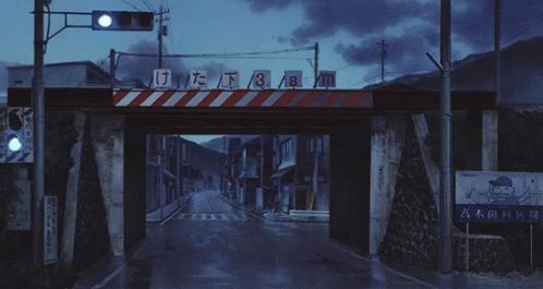A White Car Is Driving Under A Bridge With A Sign Above It That Says 3 GIF