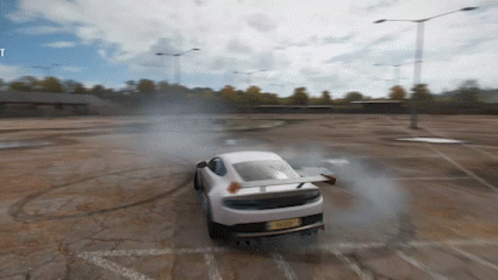 A White Car With A License Plate That Says Rx08 Is Drifting On A Dirt Road GIF
