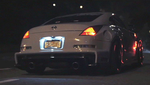 A White Car With A New York License Plate That Says Ecs-T078 GIF
