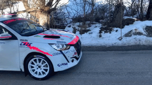 A White Car With Chazel Written On The Side GIF