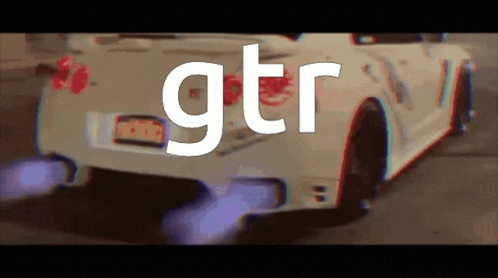 A White Car With Gtr Written On The Back GIF