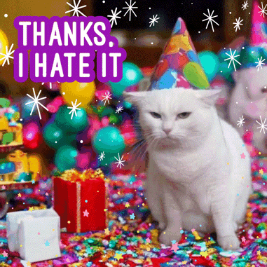 A White Cat Wearing A Party Hat Is Surrounded By Confetti And Balloons With The Words Thanks I Hate It Above It GIF