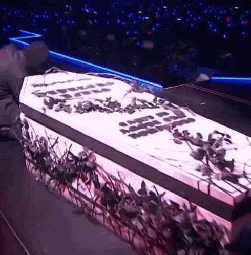 A White Coffin With The Word Jesus Written On It GIF