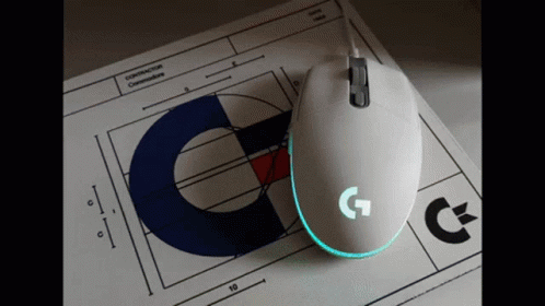 A White Computer Mouse Is Sitting On Top Of A Piece Of Paper That Says Construction Commissioners GIF