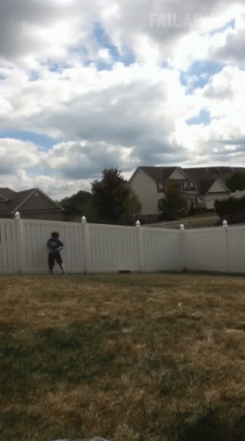 A White Fence Surrounds A Grassy Yard With A House In The Background And The Word Failland At The Bottom GIF