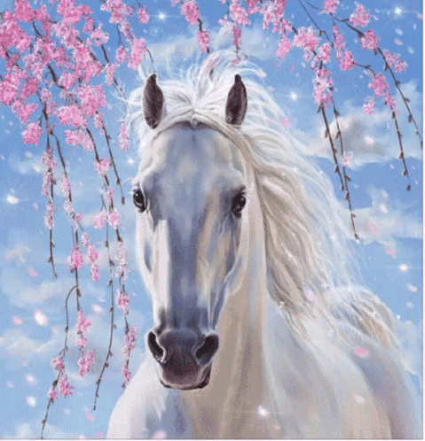 A White Horse Is Standing In Front Of A Tree With Pink Flowers GIF