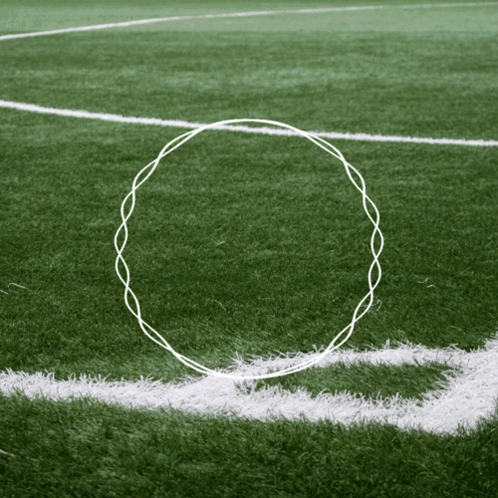 A White Line On A Soccer Field With A Circle Drawn In The Middle GIF