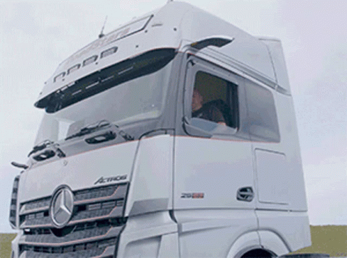 A White Mercedes Truck With The Word Actros On The Side GIF