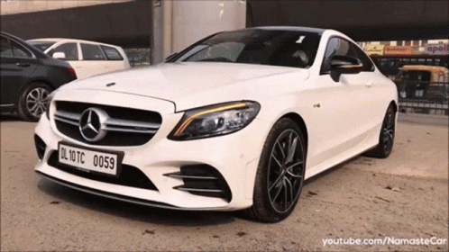A White Mercedes With A License Plate That Reads Dl 10Tc 0059 GIF