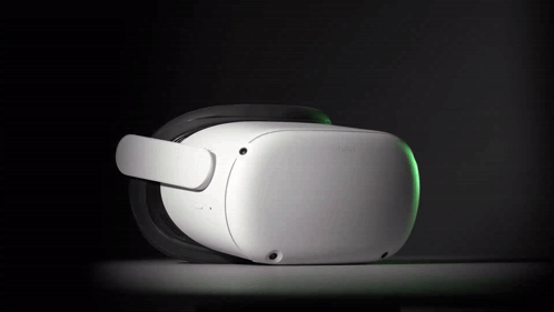 A White Oculus Virtual Reality Headset With A Green Light On It GIF