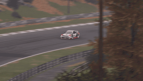 A White Race Car With The Number 4 On The Side GIF