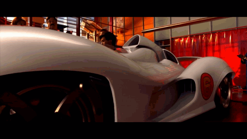 A White Race Car With The Number 5 On The Front GIF