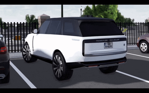 A White Range Rover Traveller Is Parked In A Parking Lot With Other Cars GIF