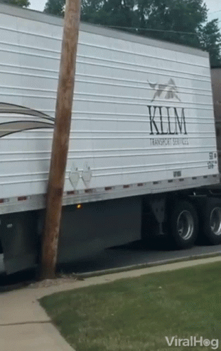 A White Semi Truck With The Word Klim On It GIF