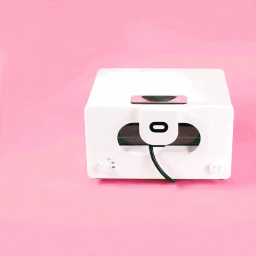 A White Toaster Oven With A Tray Of Cookies Inside GIF