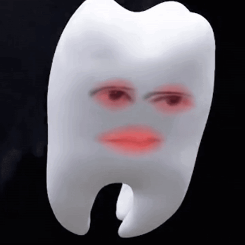 A White Tooth With A Red Face On It GIF