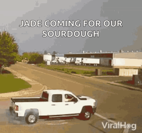 A White Truck Is Driving Down A Road With A Caption That Says Jade Coming For Our Sourdough . GIF